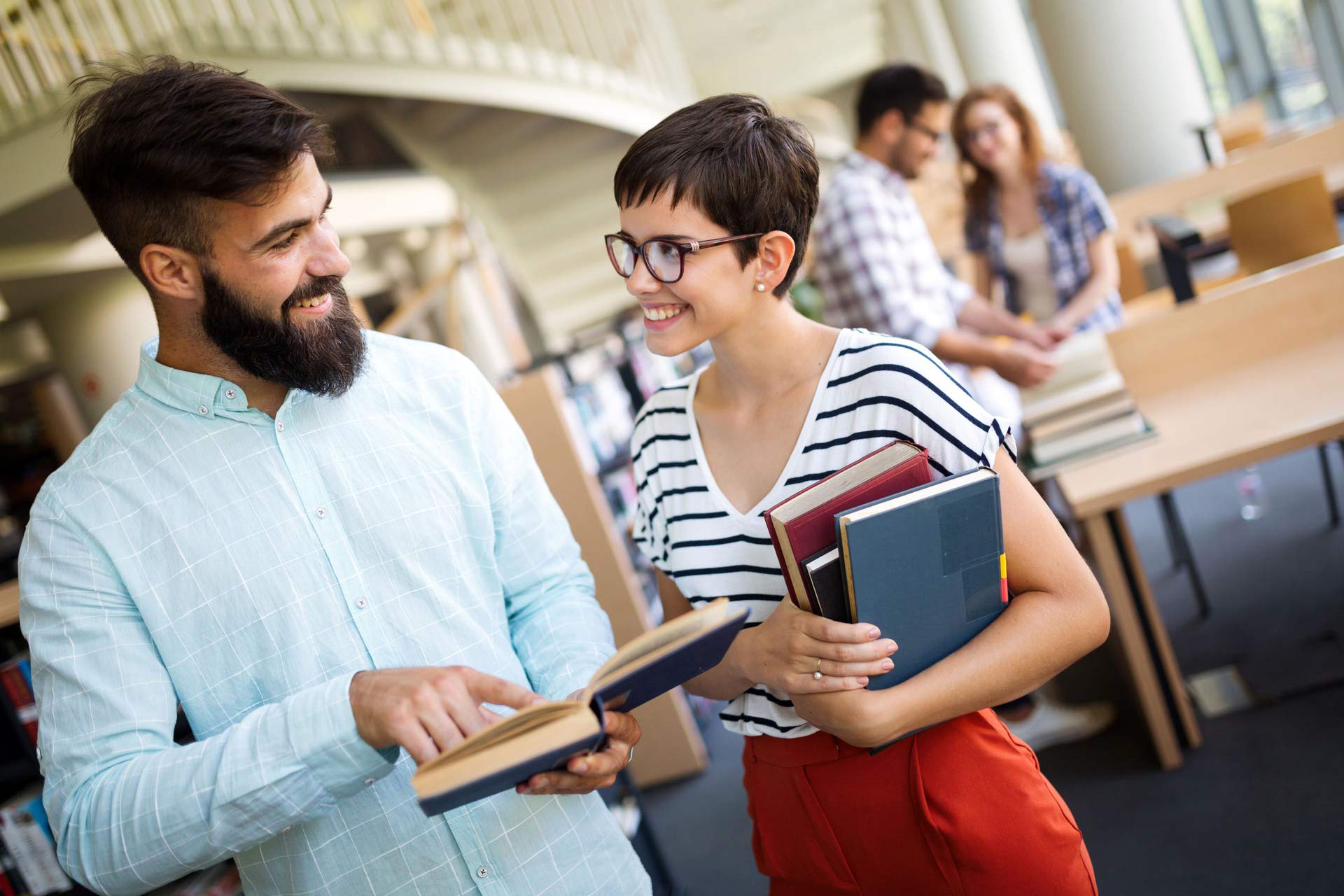 group-of-college-students-studying-at-library-SC9PWKV.jpg